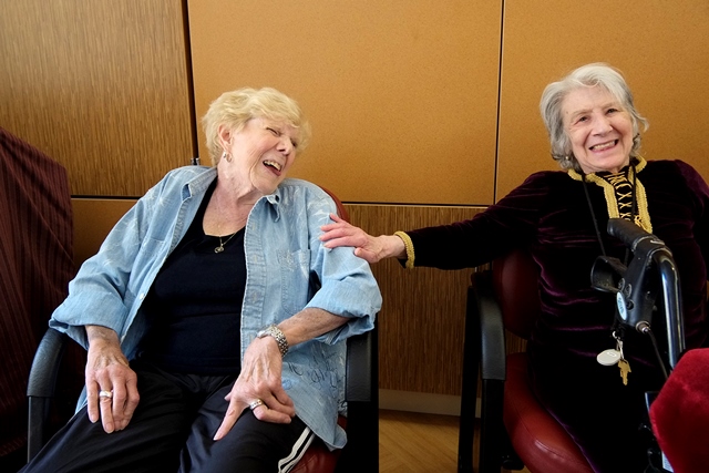 two older women laughing together